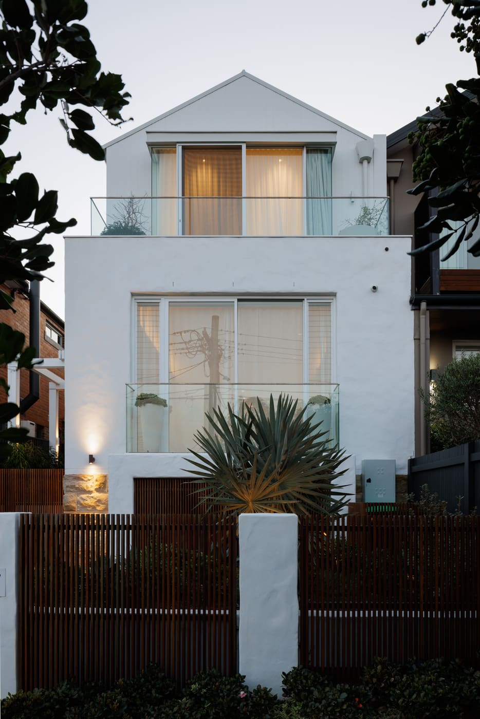 Vaucluse Residents home exterior at dusk, renovated by Structure Building