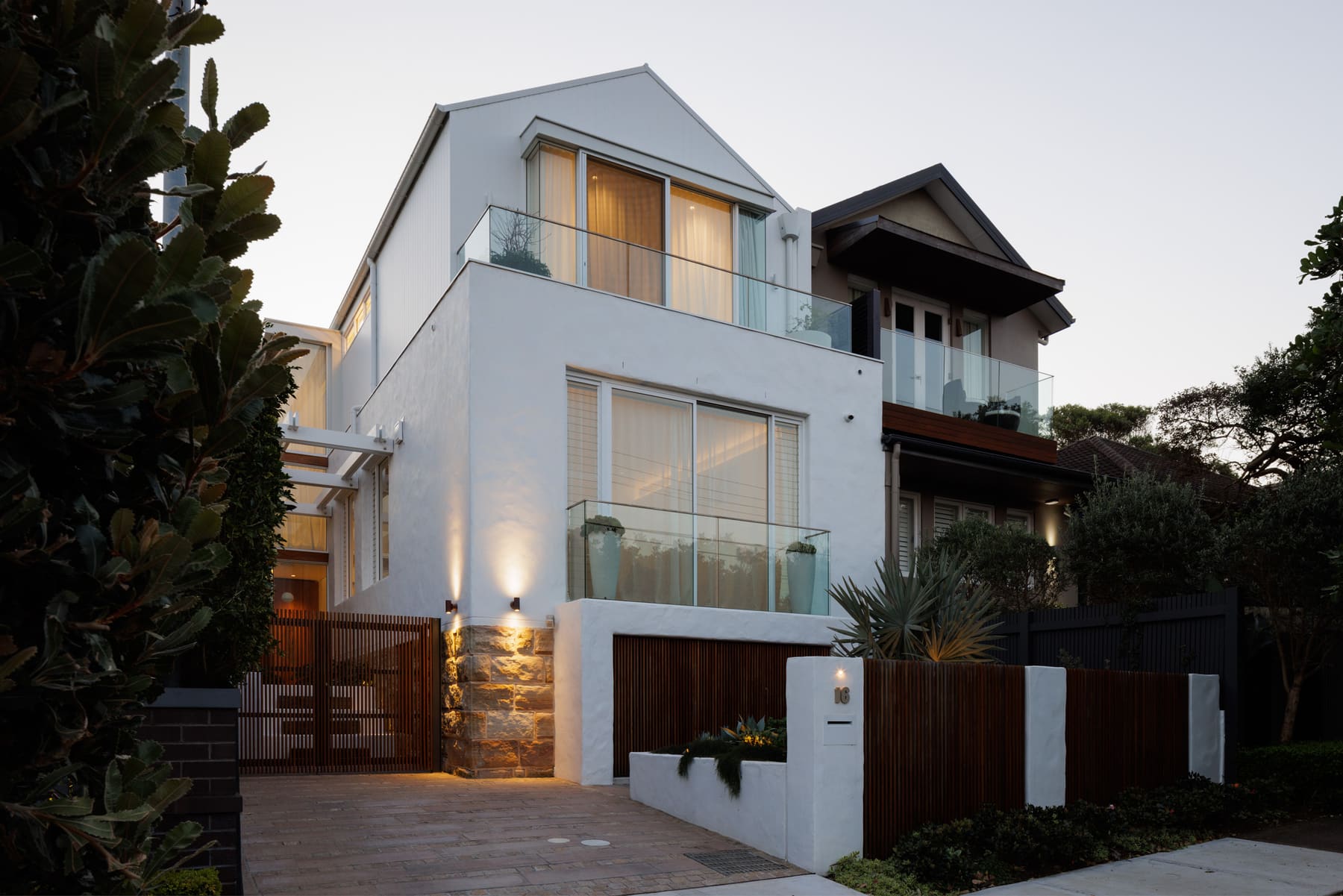 Structure Building home exterior and pool at dusk
